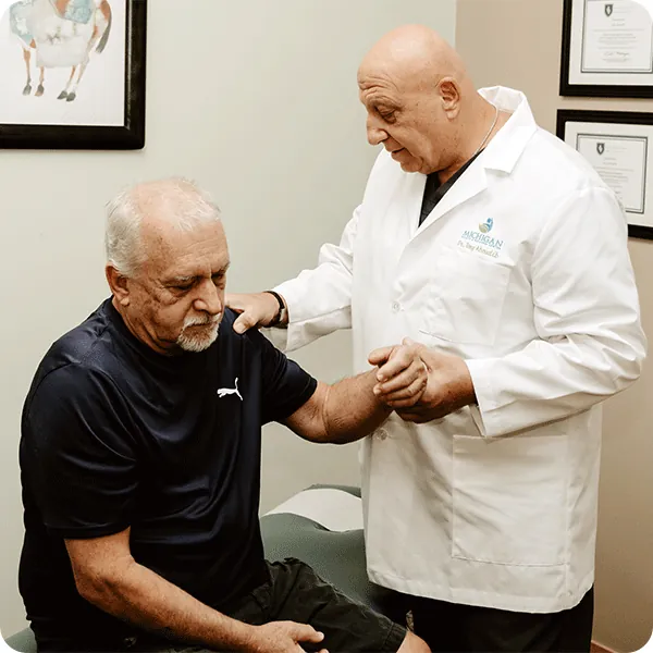 Dr. Tony checking a patient’s range of motion