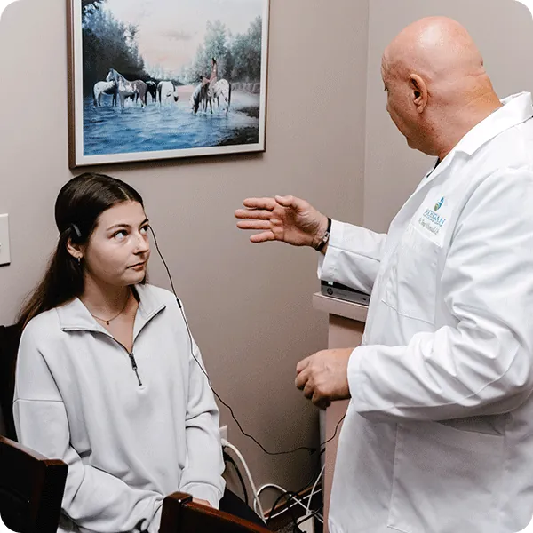 Doctor Tony instructs female patient wearing the AO Digital Body Scan