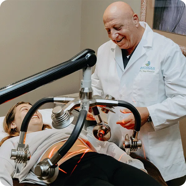 Dr. Tony performs cold laser therapy for a patient
