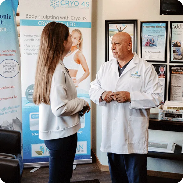 Dr. Tony consulting with a patient
