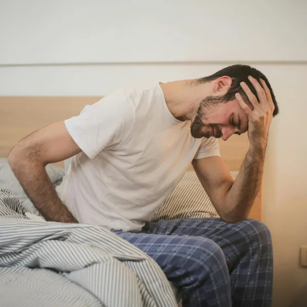 A man holding his shoulder in pain