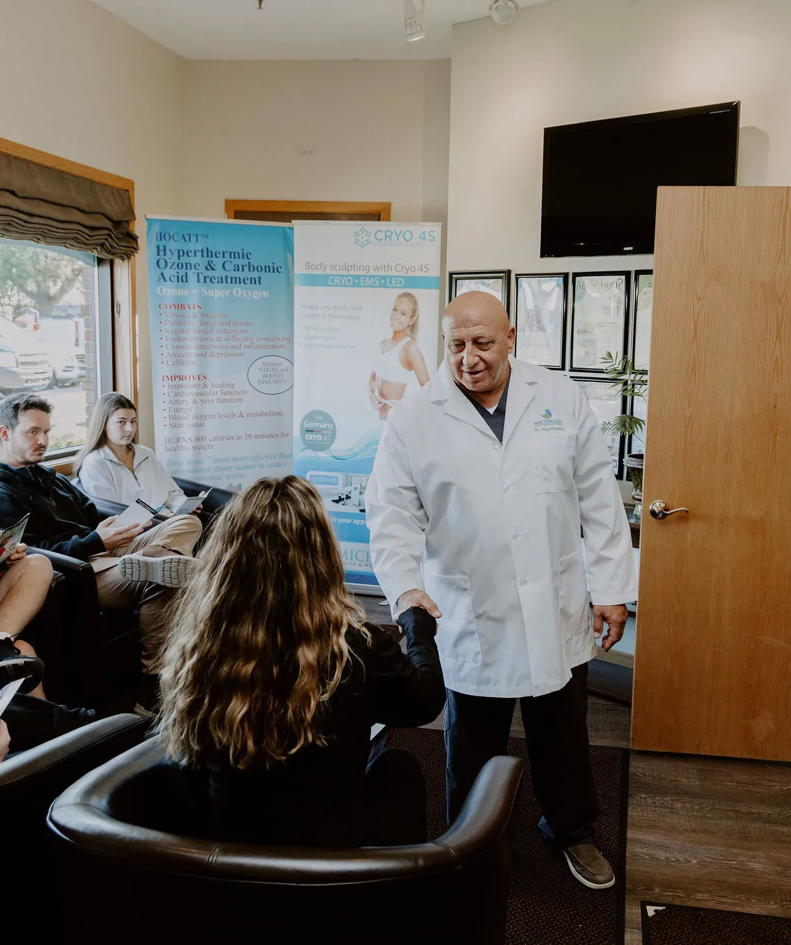 Dr. Tony greeting a patient in the clinic waiting room